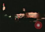 Image of elderly woman driving United States USA, 1977, second 47 stock footage video 65675078430