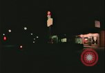 Image of elderly woman driving United States USA, 1977, second 48 stock footage video 65675078430