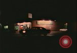 Image of elderly woman driving United States USA, 1977, second 54 stock footage video 65675078430