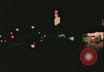 Image of elderly woman driving United States USA, 1977, second 55 stock footage video 65675078430