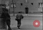 Image of street fighting US soldiers Halle Germany, 1945, second 4 stock footage video 65675078458