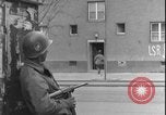 Image of street fighting US soldiers Halle Germany, 1945, second 14 stock footage video 65675078458