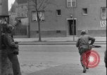 Image of street fighting US soldiers Halle Germany, 1945, second 17 stock footage video 65675078458