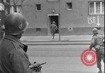 Image of street fighting US soldiers Halle Germany, 1945, second 27 stock footage video 65675078458