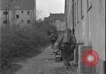 Image of street fighting US soldiers Halle Germany, 1945, second 29 stock footage video 65675078458