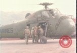 Image of wounded unloaded from Sikorsky H-34 Khe Sanh Vietnam, 1968, second 1 stock footage video 65675078587