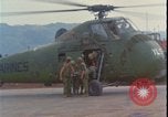 Image of wounded unloaded from Sikorsky H-34 Khe Sanh Vietnam, 1968, second 6 stock footage video 65675078587