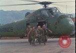 Image of wounded unloaded from Sikorsky H-34 Khe Sanh Vietnam, 1968, second 13 stock footage video 65675078587