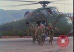 Image of wounded unloaded from Sikorsky H-34 Khe Sanh Vietnam, 1968, second 14 stock footage video 65675078587