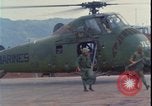 Image of wounded unloaded from Sikorsky H-34 Khe Sanh Vietnam, 1968, second 20 stock footage video 65675078587