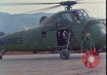 Image of wounded unloaded from Sikorsky H-34 Khe Sanh Vietnam, 1968, second 22 stock footage video 65675078587
