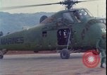 Image of wounded unloaded from Sikorsky H-34 Khe Sanh Vietnam, 1968, second 23 stock footage video 65675078587