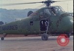 Image of wounded unloaded from Sikorsky H-34 Khe Sanh Vietnam, 1968, second 24 stock footage video 65675078587
