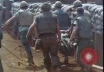 Image of wounded unloaded from Sikorsky H-34 Khe Sanh Vietnam, 1968, second 41 stock footage video 65675078587