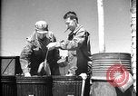 Image of United States soldiers wash mess kits Iran, 1944, second 35 stock footage video 65675078626