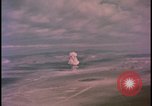 Image of aerial view distant atom bomb explosion Nevada United States USA , 1958, second 32 stock footage video 65675078692