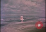 Image of aerial view distant atom bomb explosion Nevada United States USA , 1958, second 37 stock footage video 65675078692