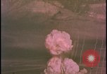 Image of two atomic bomb mushroom clouds Nevada United States USA , 1958, second 20 stock footage video 65675078693