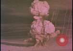 Image of two atomic bomb mushroom clouds Nevada United States USA , 1958, second 23 stock footage video 65675078693