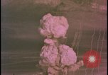 Image of two atomic bomb mushroom clouds Nevada United States USA , 1958, second 24 stock footage video 65675078693