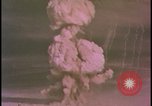 Image of two atomic bomb mushroom clouds Nevada United States USA , 1958, second 28 stock footage video 65675078693