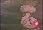 Image of two atomic bomb mushroom clouds Nevada United States USA , 1958, second 32 stock footage video 65675078693