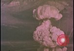Image of two atomic bomb mushroom clouds Nevada United States USA , 1958, second 35 stock footage video 65675078693