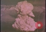 Image of two atomic bomb mushroom clouds Nevada United States USA , 1958, second 36 stock footage video 65675078693