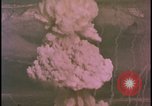 Image of two atomic bomb mushroom clouds Nevada United States USA , 1958, second 37 stock footage video 65675078693