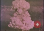 Image of two atomic bomb mushroom clouds Nevada United States USA , 1958, second 41 stock footage video 65675078693