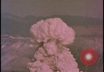 Image of two atomic bomb mushroom clouds Nevada United States USA , 1958, second 43 stock footage video 65675078693