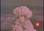 Image of two atomic bomb mushroom clouds Nevada United States USA , 1958, second 44 stock footage video 65675078693
