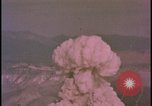 Image of two atomic bomb mushroom clouds Nevada United States USA , 1958, second 45 stock footage video 65675078693
