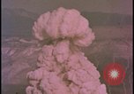 Image of two atomic bomb mushroom clouds Nevada United States USA , 1958, second 48 stock footage video 65675078693