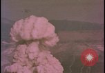 Image of two atomic bomb mushroom clouds Nevada United States USA , 1958, second 49 stock footage video 65675078693