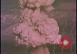 Image of two atomic bomb mushroom clouds Nevada United States USA , 1958, second 54 stock footage video 65675078693