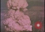 Image of two atomic bomb mushroom clouds Nevada United States USA , 1958, second 55 stock footage video 65675078693
