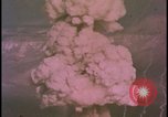 Image of two atomic bomb mushroom clouds Nevada United States USA , 1958, second 57 stock footage video 65675078693