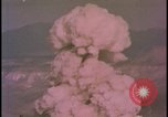 Image of two atomic bomb mushroom clouds Nevada United States USA , 1958, second 58 stock footage video 65675078693