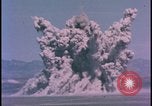 Image of underground atom bomb testing dust cloud Nevada United States USA , 1958, second 3 stock footage video 65675078695