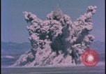 Image of underground atom bomb testing dust cloud Nevada United States USA , 1958, second 4 stock footage video 65675078695