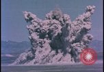 Image of underground atom bomb testing dust cloud Nevada United States USA , 1958, second 5 stock footage video 65675078695