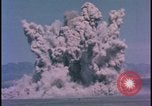 Image of underground atom bomb testing dust cloud Nevada United States USA , 1958, second 24 stock footage video 65675078695
