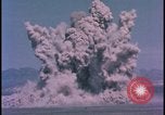 Image of underground atom bomb testing dust cloud Nevada United States USA , 1958, second 26 stock footage video 65675078695