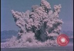Image of underground atom bomb testing dust cloud Nevada United States USA , 1958, second 27 stock footage video 65675078695