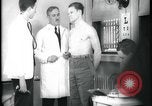 Image of physical examination United States USA, 1937, second 51 stock footage video 65675078712