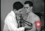 Image of physical examination United States USA, 1937, second 52 stock footage video 65675078712