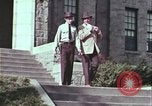 Image of police car rural road United States USA, 1964, second 16 stock footage video 65675078748