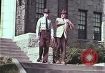 Image of police car rural road United States USA, 1964, second 17 stock footage video 65675078748