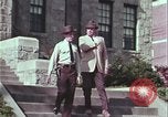 Image of police car rural road United States USA, 1964, second 20 stock footage video 65675078748